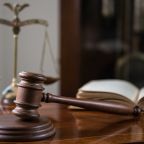 Sixth Circuit Invalidates Contractual Limitations Period for Title VII Claims - photo of gavel and scales of justice